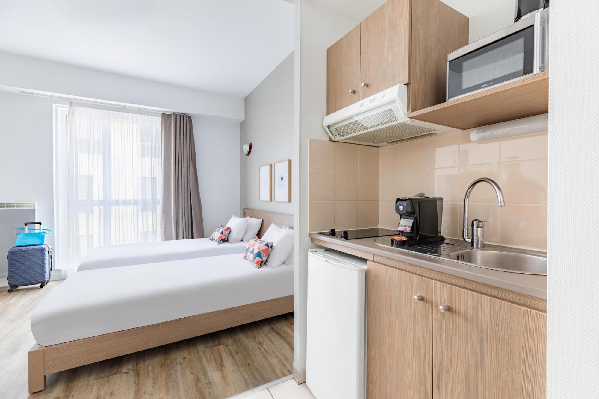 อัปปาร์ตซิตี้ เลอ ม็อง ซองทร์ Aparthotel เลอม็องส์ ภายนอก รูปภาพ