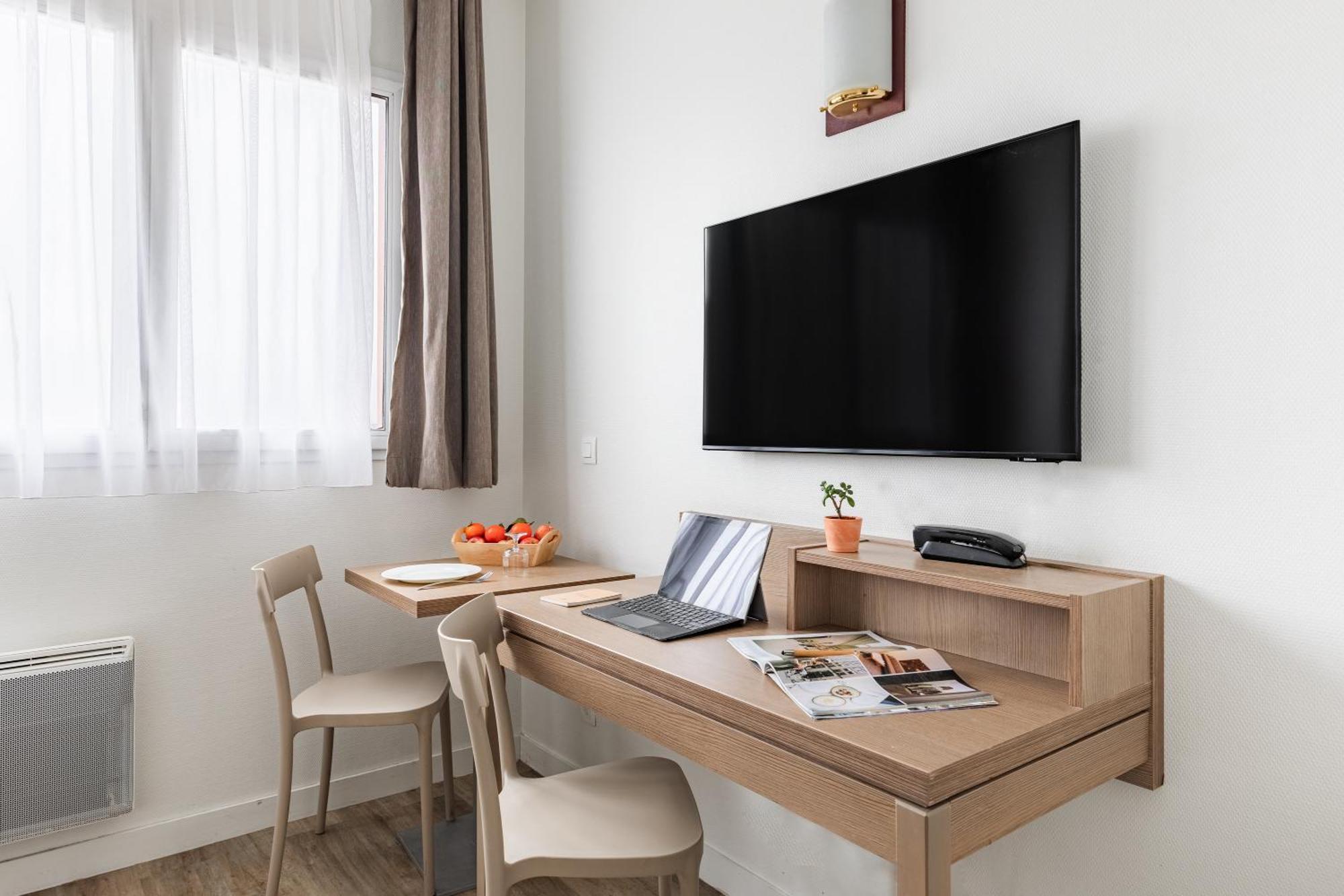 อัปปาร์ตซิตี้ เลอ ม็อง ซองทร์ Aparthotel เลอม็องส์ ภายนอก รูปภาพ