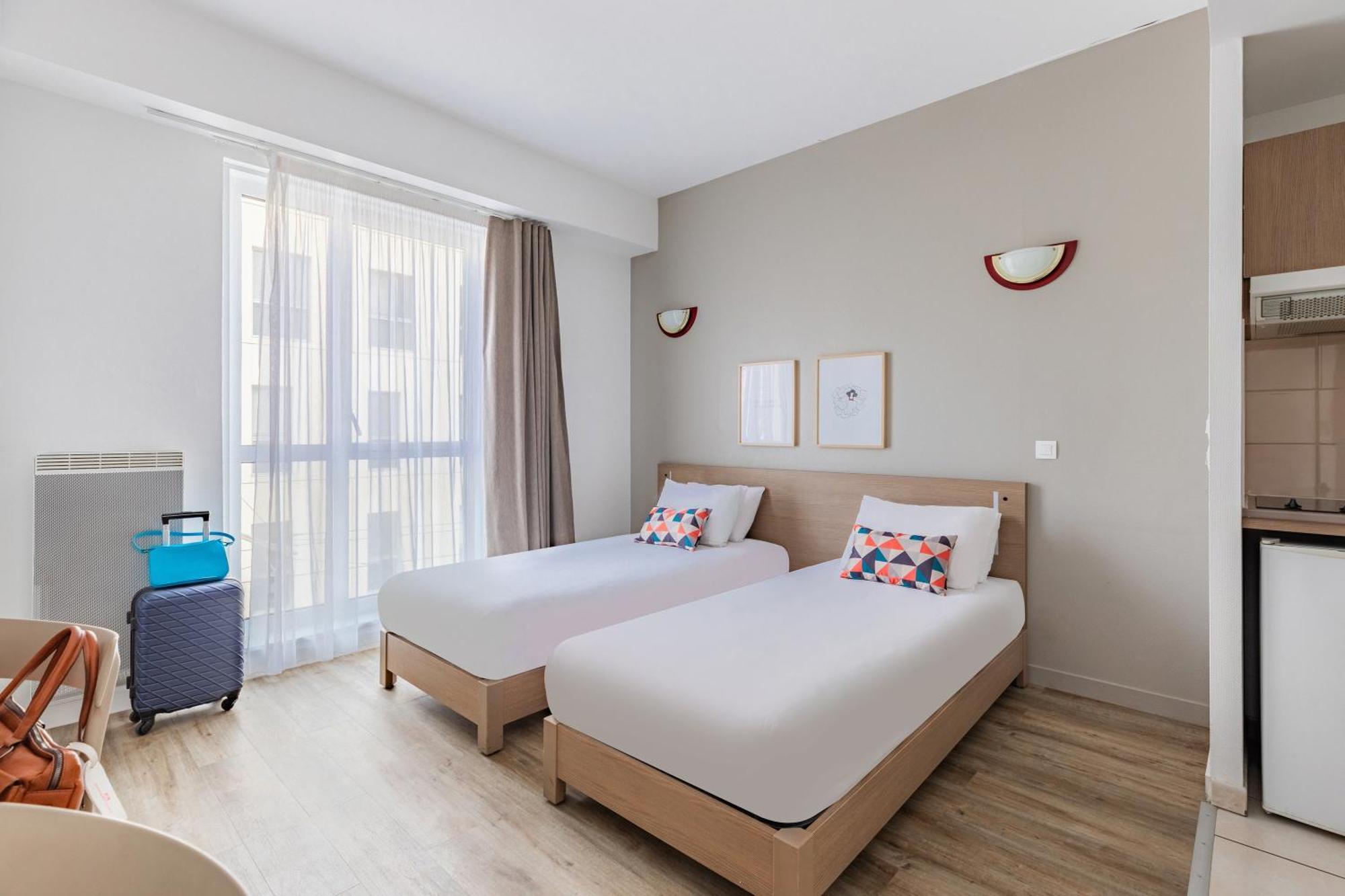 อัปปาร์ตซิตี้ เลอ ม็อง ซองทร์ Aparthotel เลอม็องส์ ภายนอก รูปภาพ